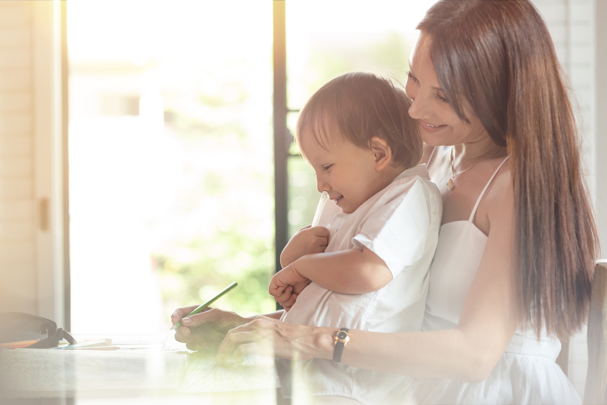 For growing and learning. Mom nursing toddler indoors.